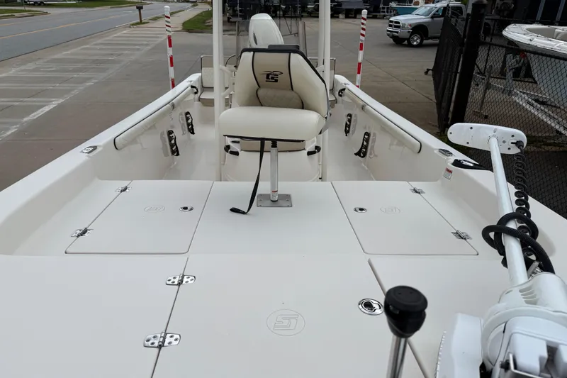 Slide: The Image of 2020 Carolina Skiff 21 LS boat interior with seating and storage compartments. - 35