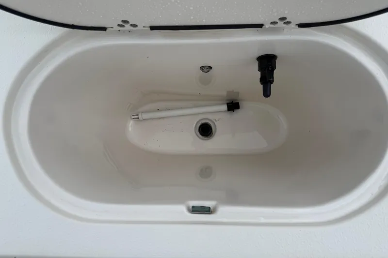 Slide: The Image of 2020 Carolina Skiff 21 LS livewell interior with drain and fittings. - 42