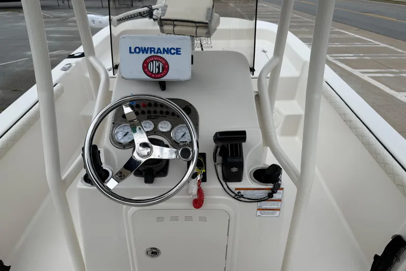 Slide: The Image of 2020 Carolina Skiff 21 LS boat console with steering wheel and navigation equipment. - 45