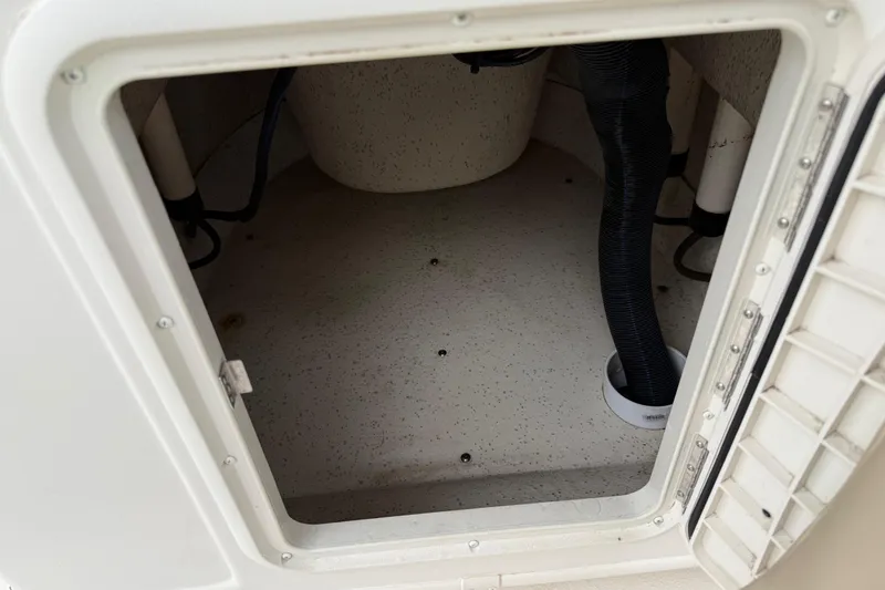 Slide: The Image of Open storage compartment in a 2020 Carolina Skiff 21 LS boat, showing interior details. - 53