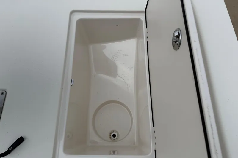 Slide: The Image of Open storage compartment on a 2020 Carolina Skiff 21 LS boat. - 57