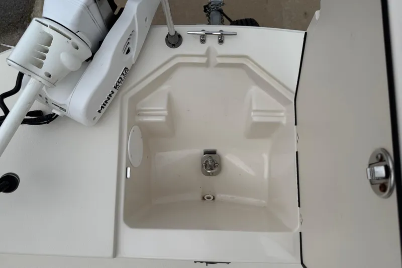 Slide: The Image of 2020 Carolina Skiff 21 LS boat compartment with Minn Kota trolling motor. - 59