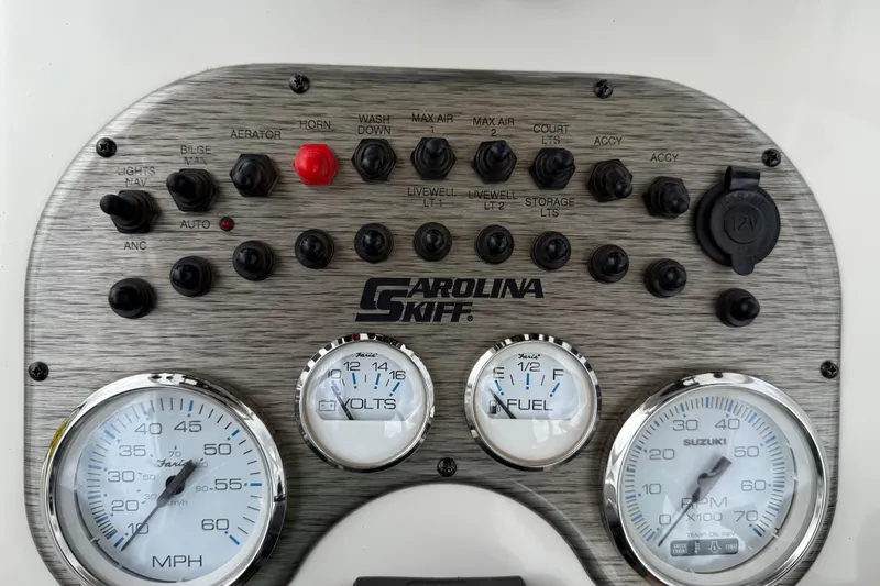 Slide: The Image of Control panel of a 2020 Carolina Skiff 21 LS boat with gauges and switches. - 63
