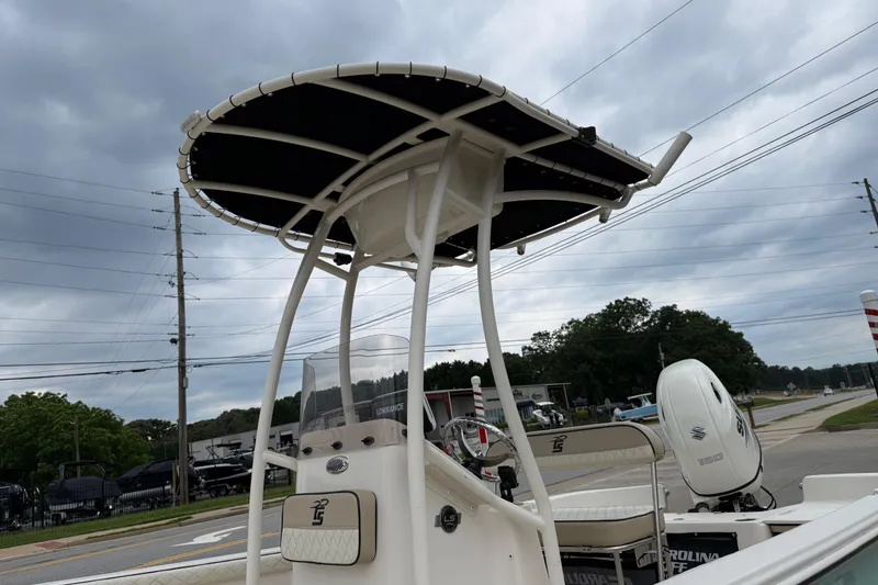 Slide: The Image of 2020 Carolina Skiff 21 LS boat with T-top and Suzuki outboard motor. - 64