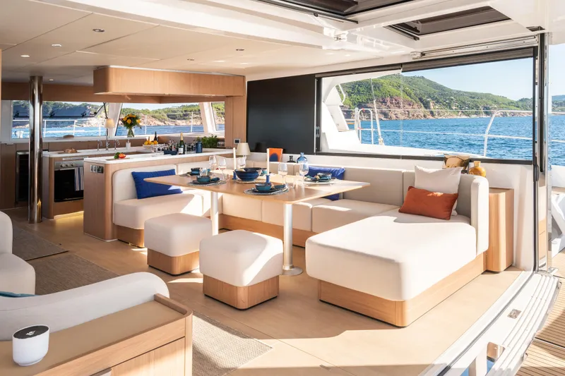 Slide: The Image of Luxurious interior of 2026 Bali 5.8 yacht with elegant dining area and ocean view. - 1