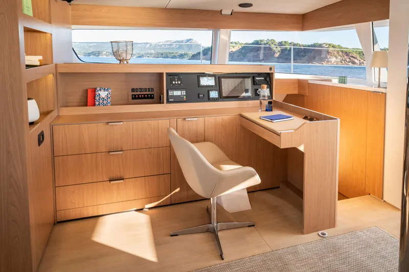 Slide: The Image of Modern navigation station in 2026 Bali 5.8 yacht with sleek wood design and ocean view. - 9