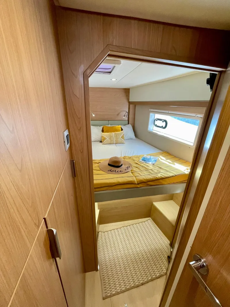 Slide: The Image of Cozy cabin interior of 2026 Bali 4.2 yacht with bed and window view. - 24