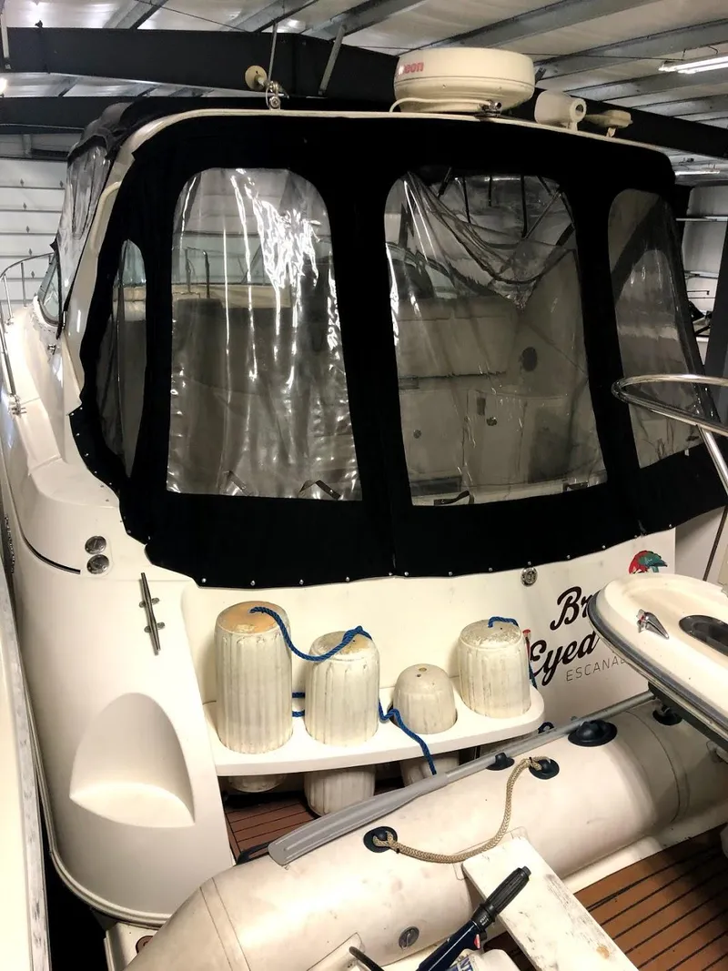 Slide: The Image of 2000 Cruisers Yachts 3575 Express in storage, rear view. - 10