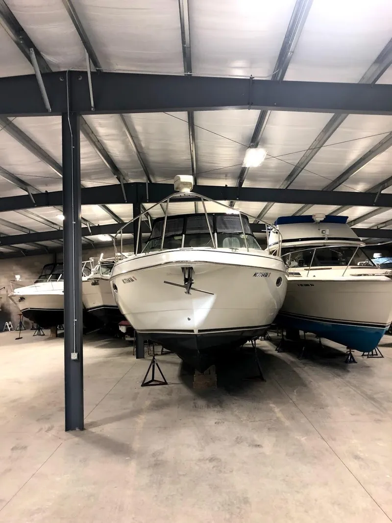 Slide: The Image of 2000 Cruisers Yachts 3575 Express stored in a warehouse. - 11
