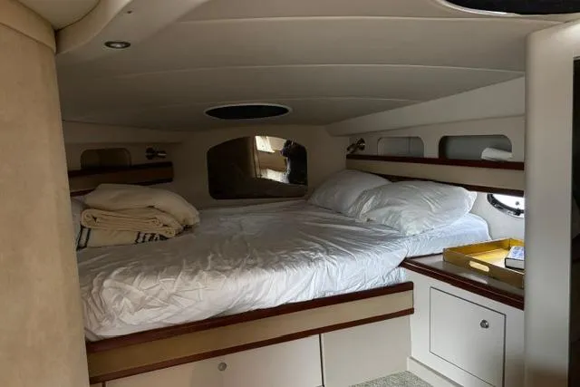 Slide: The Image of Interior cabin of 2000 Cruisers Yachts 3575 Express with cozy bed and storage. - 34