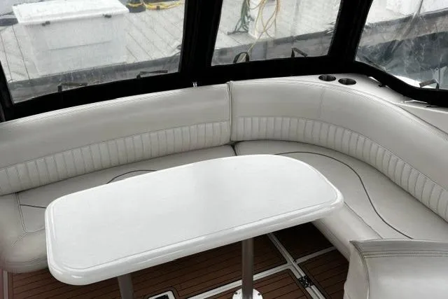 Slide: The Image of Luxurious seating area on 2000 Cruisers Yachts 3575 Express with white leather upholstery. - 37