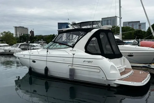 Slide: The Image of 2000 Cruisers Yachts 3575 Express docked in a marina, side view. - 8
