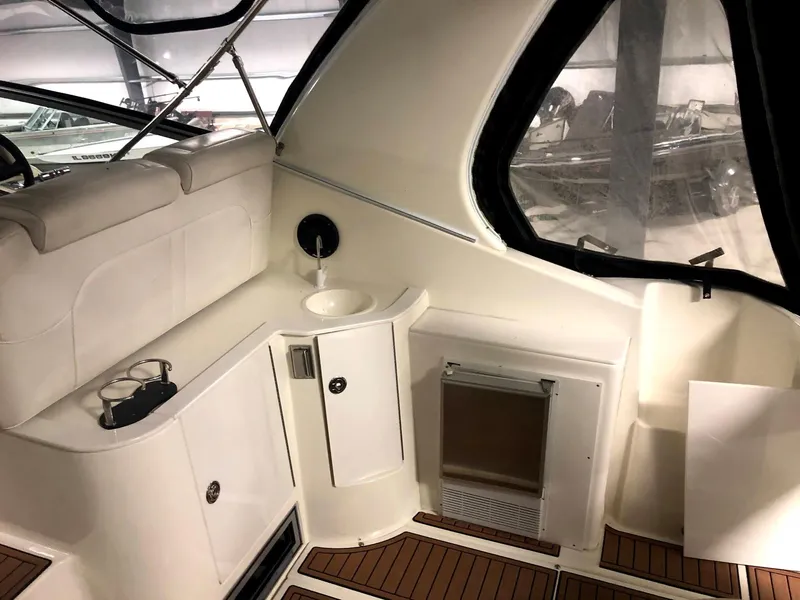 Slide: The Image of Interior of 2000 Cruisers Yachts 3575 Express with sink and wood flooring. - 9