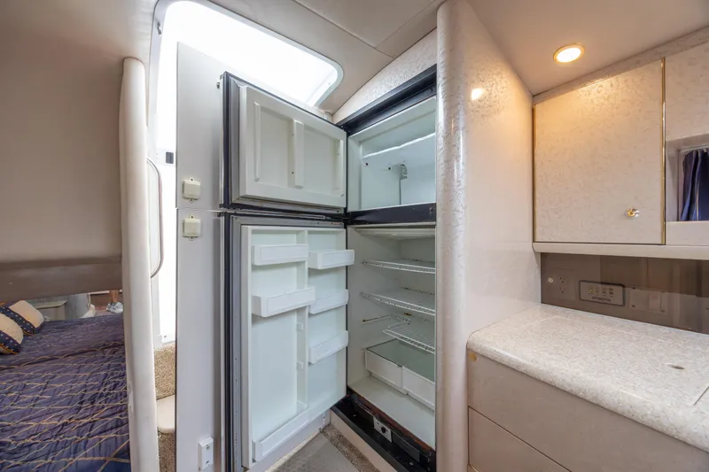 Slide: The Image of Open refrigerator in 2003 Formula 400 Super Sport yacht interior, near cabin and kitchenette. - 26