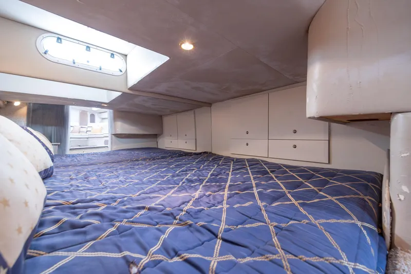 Slide: The Image of Interior cabin of 2003 Formula 400 Super Sport yacht with cozy bed and storage. - 28