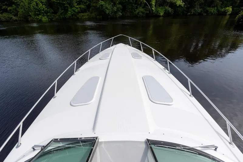 Slide: The Image of Bow view of 2003 Formula 400 Super Sport yacht on calm water. - 9