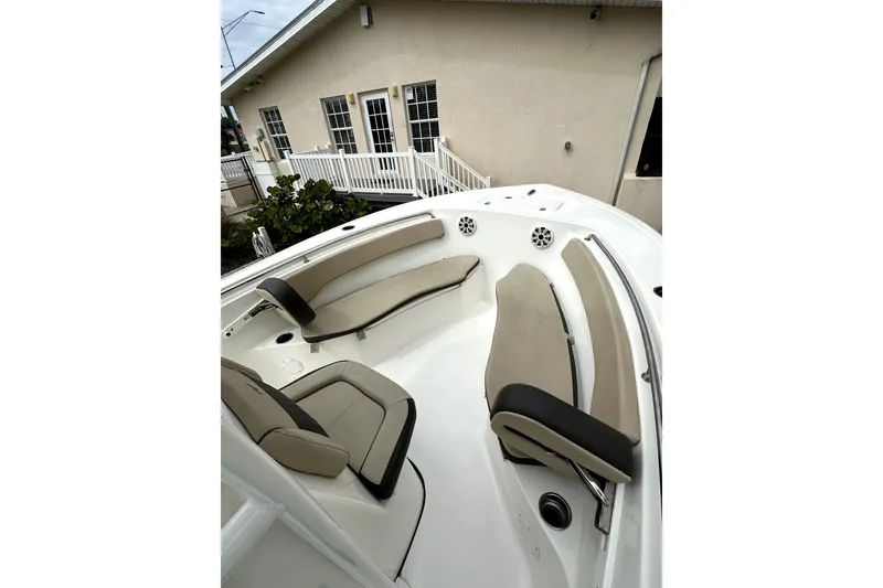 Slide: The Image of 2018 Tidewater 220 LXF boat interior with beige seating and modern design. - 4