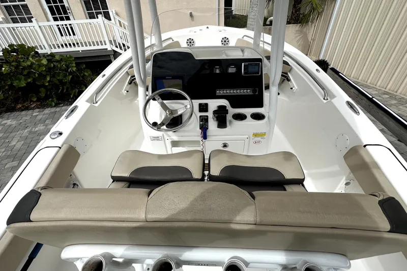 Slide: The Image of 2018 Tidewater 220 LXF boat cockpit with steering wheel and control panel. - 6
