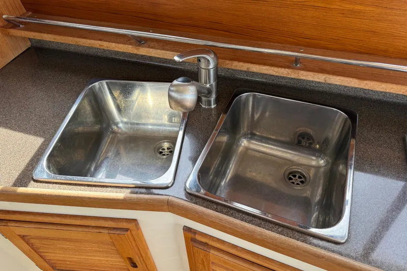 Slide: The Image of Stainless steel double sink in 2020 Ranger Tugs R-31 CB boat kitchen. - 18