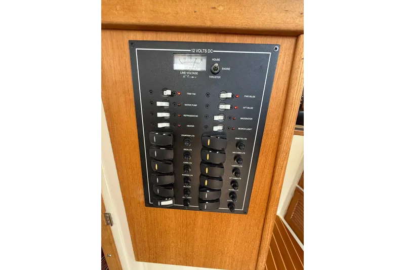 Slide: The Image of Electrical control panel on 2020 Ranger Tugs R-31 CB boat, featuring various switches and indicators. - 20