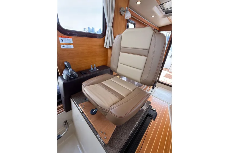 Slide: The Image of Captain's seat in 2020 Ranger Tugs R-31 CB boat interior. - 31