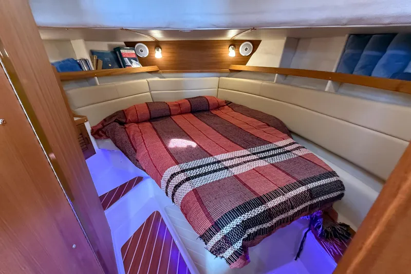 Slide: The Image of Cozy cabin interior of 2020 Ranger Tugs R-31 CB with bed and ambient lighting. - 33