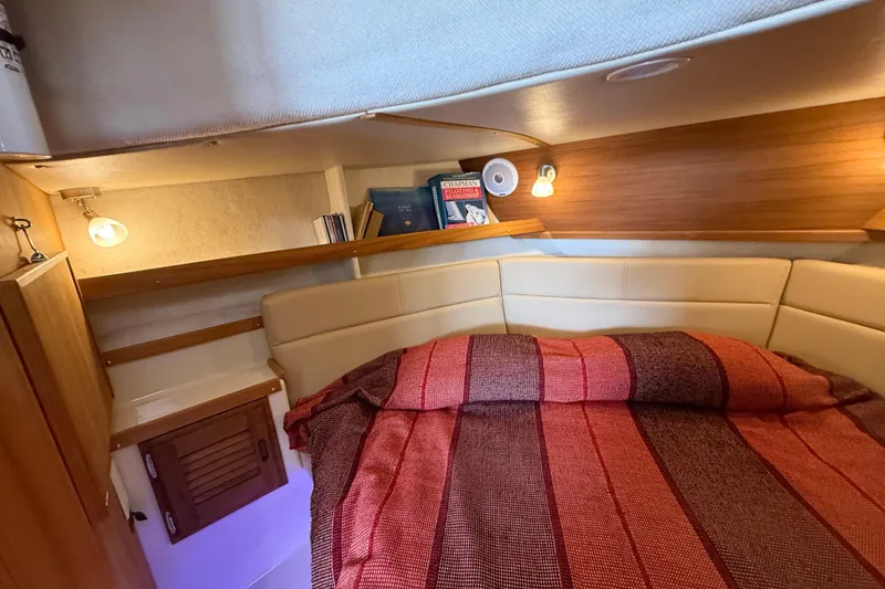 Slide: The Image of Cozy cabin interior of 2020 Ranger Tugs R-31 CB with bed and reading lights. - 35