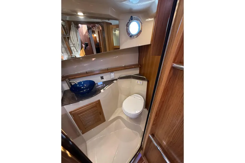 Slide: The Image of Luxurious bathroom in 2020 Ranger Tugs R-31 CB boat with modern fixtures and porthole. - 37