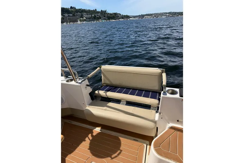 Slide: The Image of 2020 Ranger Tugs R-31 CB boat with beige seating on a sunny day. - 7