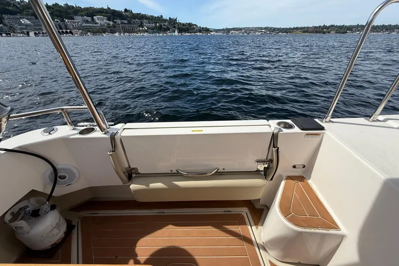 Slide: The Image of 2020 Ranger Tugs R-31 CB boat deck overlooking scenic waterfront view. - 8
