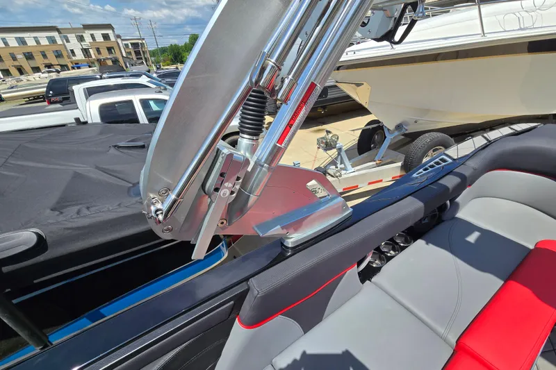 Slide: The Image of 2019 MasterCraft XT25 boat interior with sleek seating and polished metal components. - 35