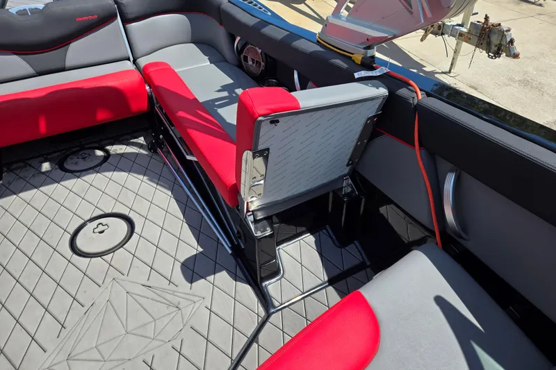 Slide: The Image of 2019 MasterCraft XT25 interior with red and gray seating, showcasing modern design and comfort. - 39
