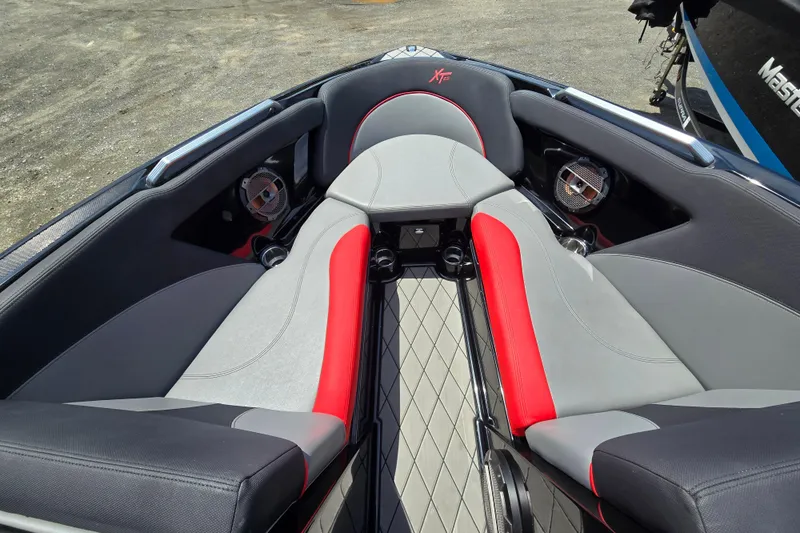 Slide: The Image of Interior of 2019 MasterCraft XT25 boat with gray and red seating. - 48