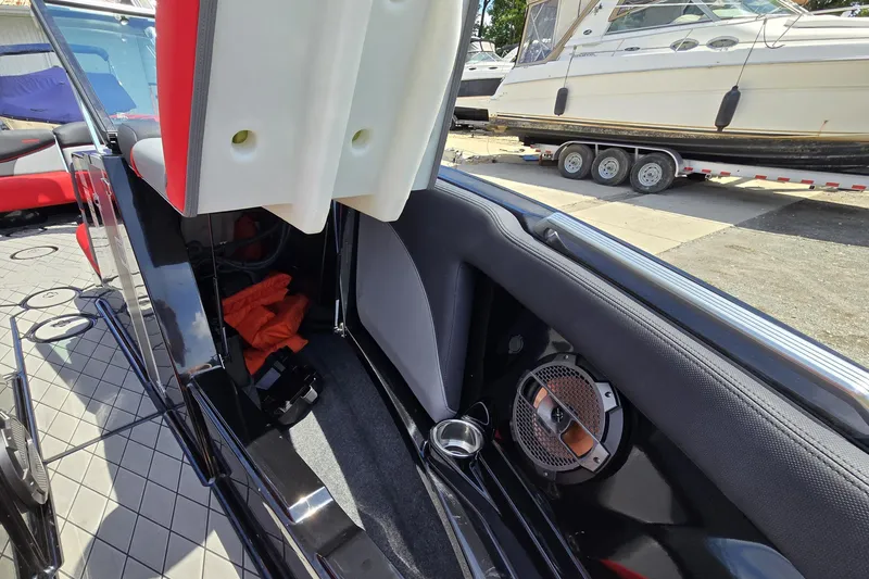 Slide: The Image of Interior view of a 2019 MasterCraft XT25 boat, showcasing seating and speaker details. - 49