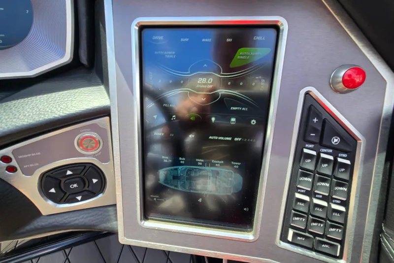 Slide: The Image of 2019 MasterCraft XT25 dashboard with touchscreen controls and navigation buttons. - 58