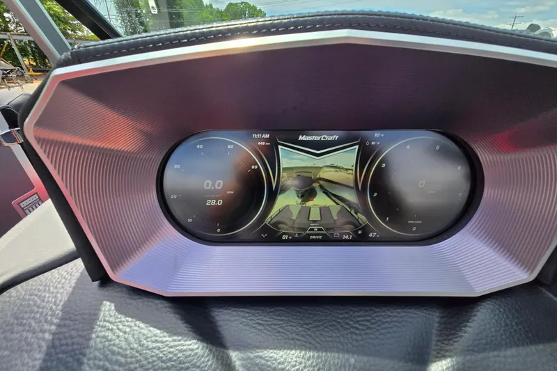 Slide: The Image of Dashboard of a 2019 MasterCraft XT25 boat displaying speed and navigation controls. - 59