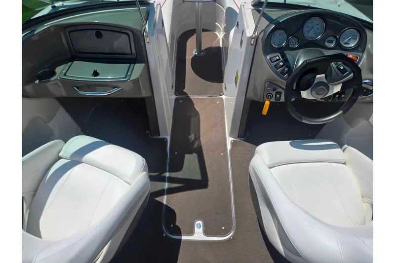 Slide: The Image of 2008 Rinker 226 Captiva Bowrider interior with steering wheel and seating. - 12