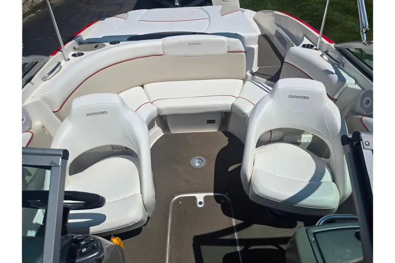 Slide: The Image of 2008 Rinker 226 Captiva Bowrider interior with white seating and red accents. - 22