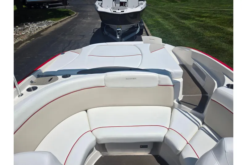 Slide: The Image of 2008 Rinker 226 Captiva Bowrider interior with white seating and red accents. - 23