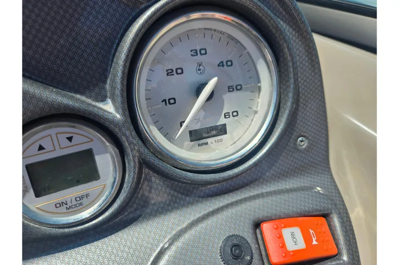 Slide: The Image of Dashboard of 2008 Rinker 226 Captiva Bowrider with speedometer and horn button. - 24