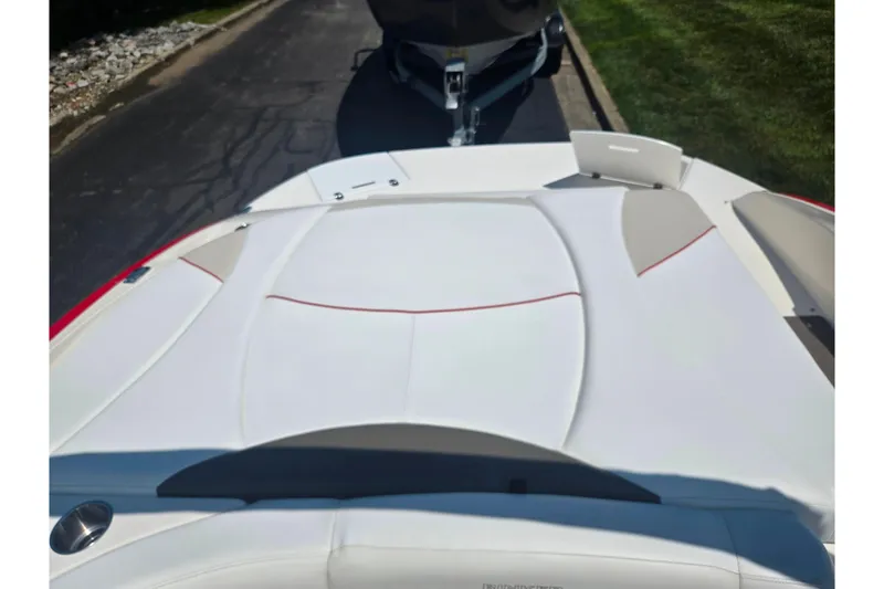 Slide: The Image of 2008 Rinker 226 Captiva Bowrider boat interior with white and red upholstery. - 25