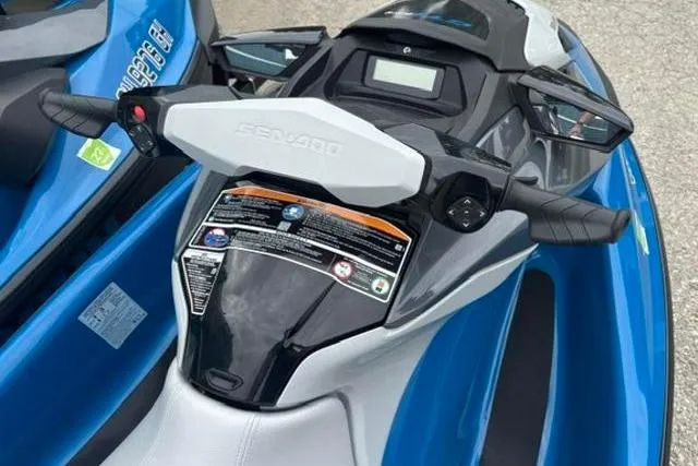 Slide: The Image of 2021 Seadoo GTI SE 130 jet ski, blue and white, top view of handlebars and seat. - 12