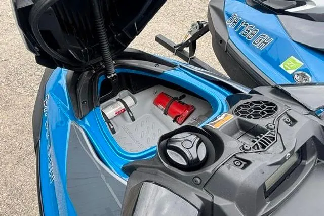 Slide: The Image of 2021 Seadoo GTI SE 130 jet ski with open storage compartment, showcasing interior features. - 15