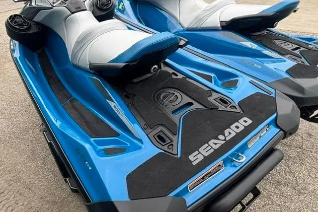 Slide: The Image of 2021 Seadoo GTI SE 130 jet ski, blue and white design, rear view. - 20