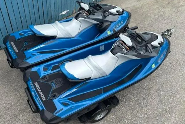 Slide: The Image of Two blue 2021 Seadoo GTI SE 130 jet skis on a trailer. - 7