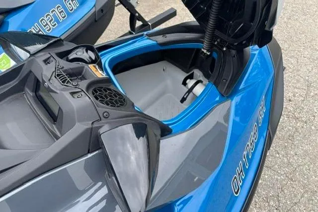 Slide: The Image of 2021 Seadoo GTI SE 130 jet ski with open storage compartment, blue and gray design. - 8