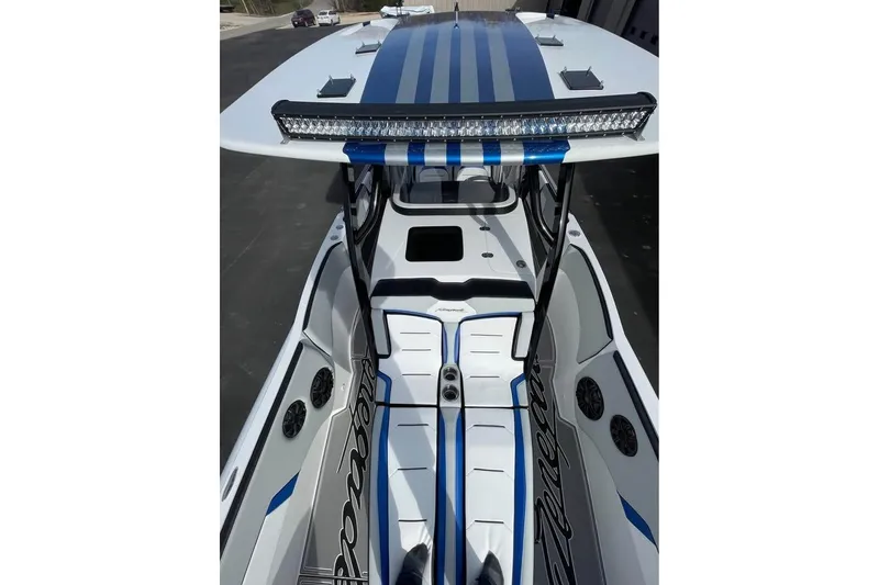 Slide: The Image of 2026 Renegade 38 Open boat with sleek design, blue accents, and advanced lighting. - 10