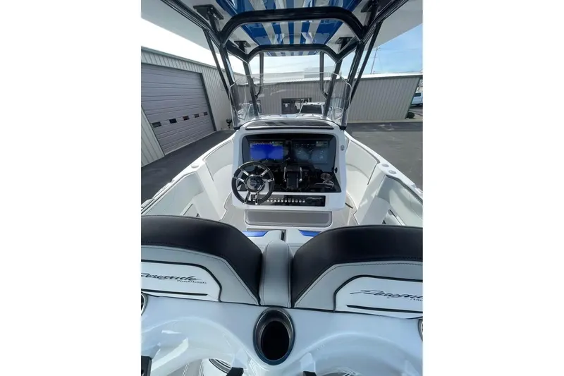 Slide: The Image of 2026 Renegade 38 Open boat cockpit with modern steering and navigation system. - 13