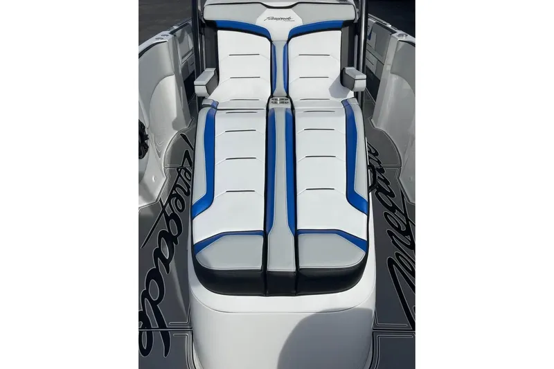 Slide: The Image of 2026 Renegade 38 Open boat interior with sleek white and blue seating design. - 4