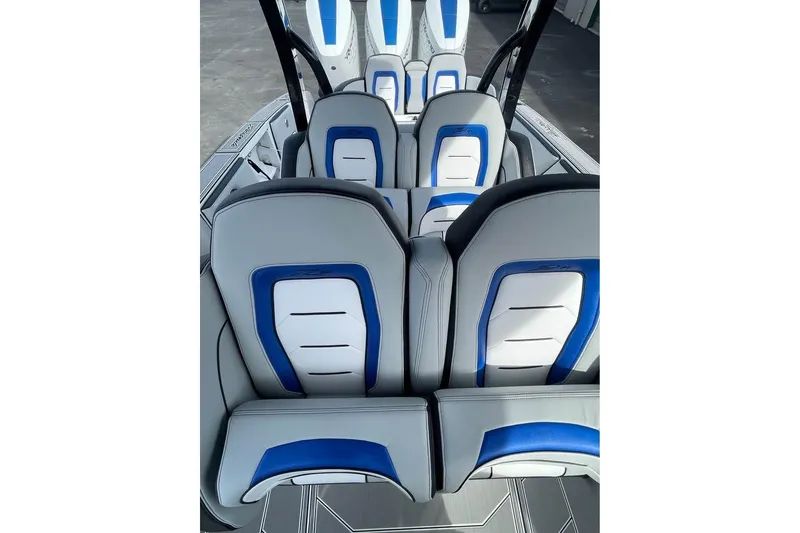 Slide: The Image of 2026 Renegade 38 Open boat interior with stylish blue and white seating. - 5